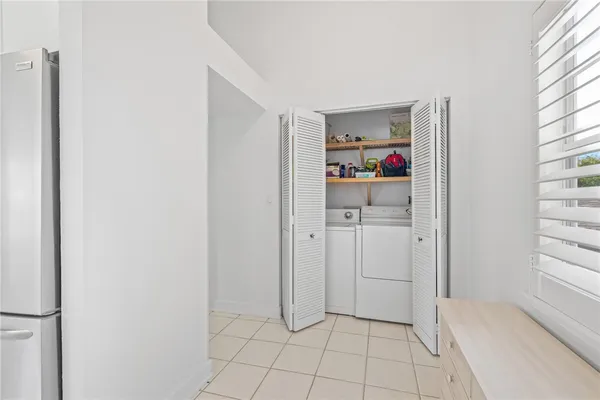 a bedroom with a bed and a table
