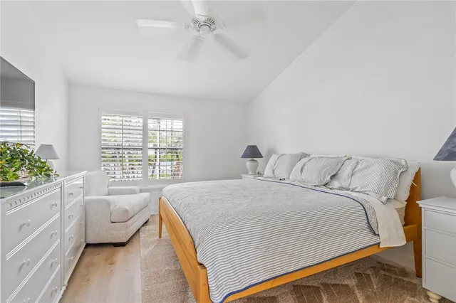 a spacious bedroom with a bed and a couch