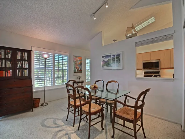 a dining room with furniture and window