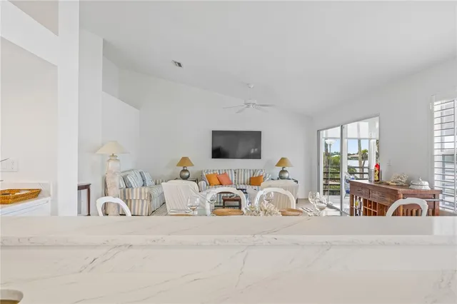 a bedroom with furniture and a flat screen tv