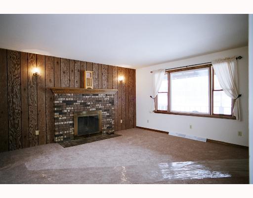 595 Frankfort Road Monaca, PA 15061 - Photo 7 of 16 Den/Family/Great Room. All new carpet, log fireplace, wood paneling on 1 wall, great picture window looking out to the front yard.