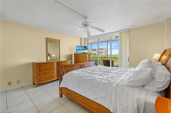 a bedroom with a bed and cabinets