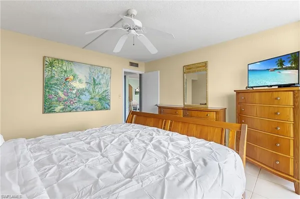 a bedroom with a bed and a dresser