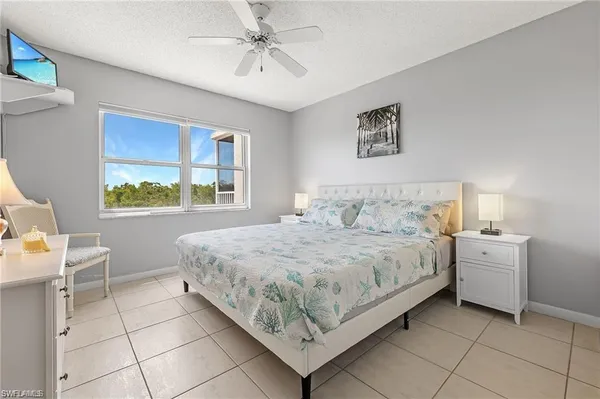 a bedroom with a bed and a table