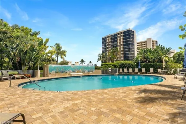 a view of a swimming pool with a patio