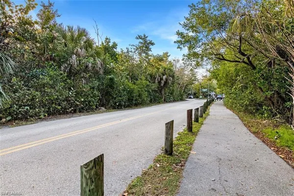 a view of a pathway with a park