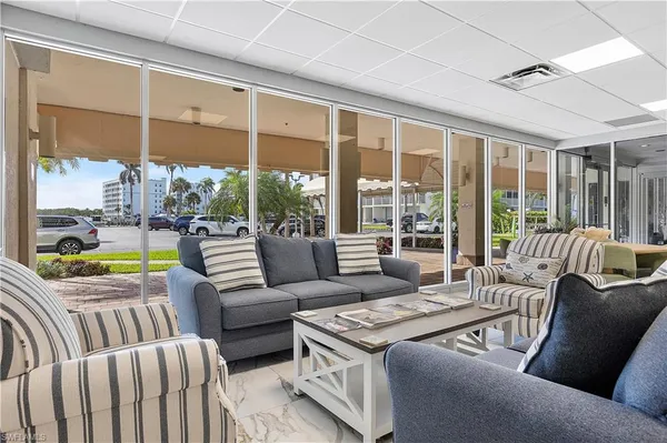 a kitchen with a sink a refrigerator and cabinets