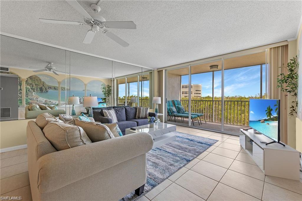 5 Bluebill Avenue, Unit 403 Naples, FL 34108 - Photo 6 of 41 a living room with furniture