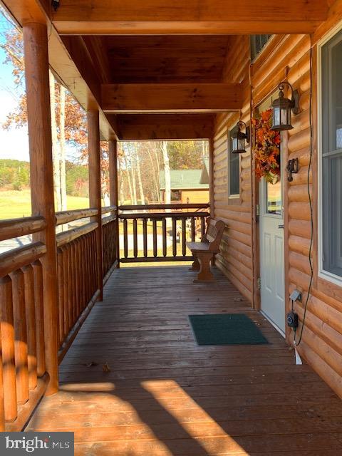 1461 Big Creek Road Clearville, PA 15535 - Photo 101 of 138 a view of porch with wooden floor and outdoor seating