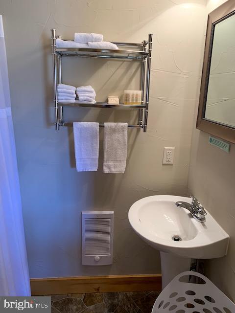 1461 Big Creek Road Clearville, PA 15535 - Photo 105 of 138 a bathroom with a sink and mirror