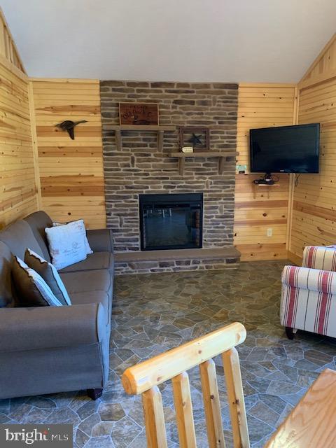 1461 Big Creek Road Clearville, PA 15535 - Photo 106 of 138 a living room with furniture flat screen tv and a fireplace