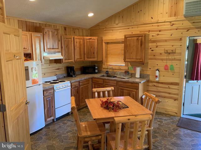 1461 Big Creek Road Clearville, PA 15535 - Photo 131 of 138 a kitchen with stainless steel appliances granite countertop a sink a stove a refrigerator cabinets a dining table and chairs
