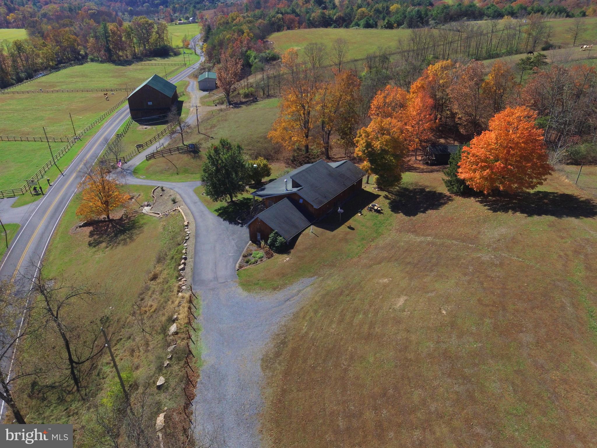 1461 Big Creek Road Clearville, PA 15535 - Photo 18 of 138 an aerial view of a house with outdoor space and a lake view in back