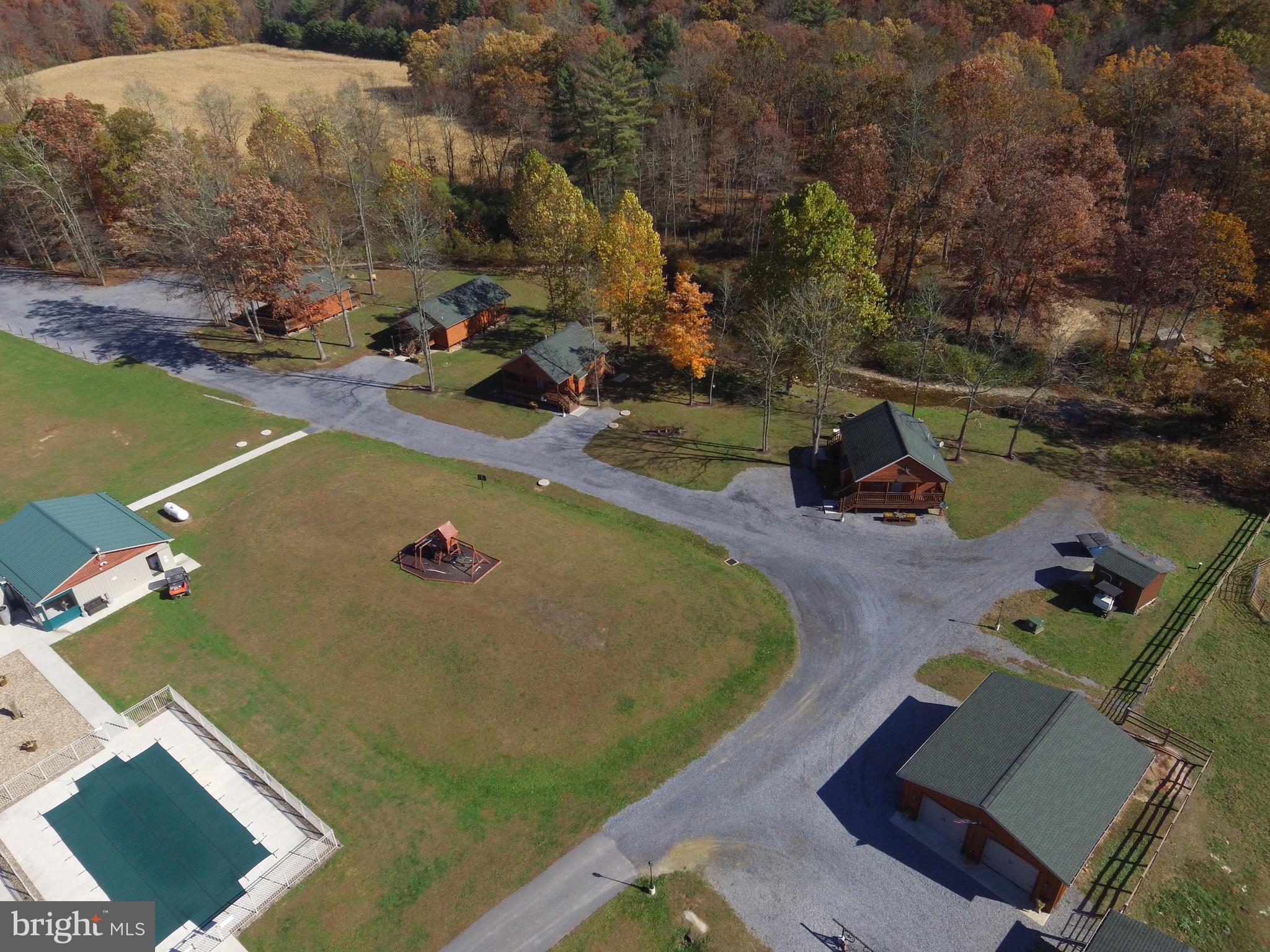 1461 Big Creek Road Clearville, PA 15535 - Photo 22 of 138 an aerial view of a house with a swimming pool