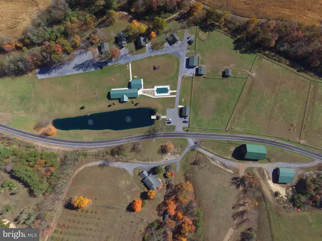 an aerial view of a house with outdoor space