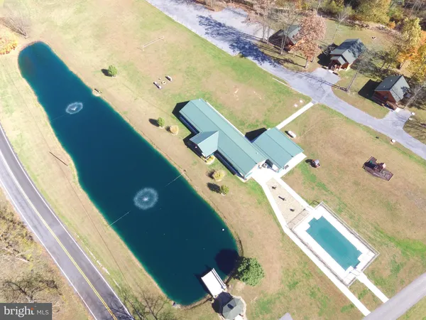 a living room with furniture flat screen tv and a fireplace