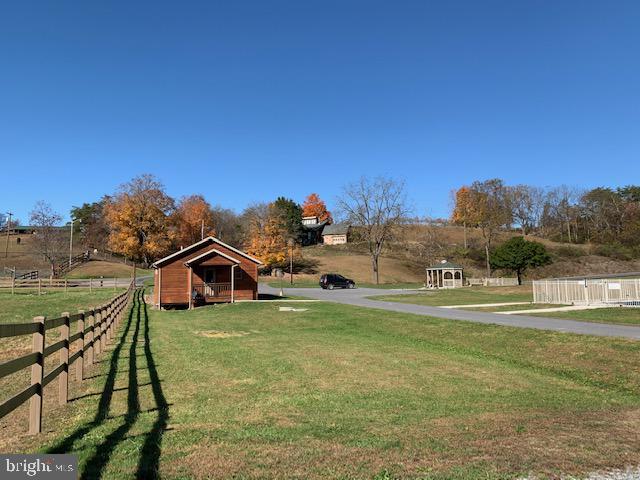 1461 Big Creek Road Clearville, PA 15535 - Photo 61 of 138 a view of a house with swimming pool and a yard