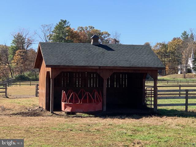 1461 Big Creek Road Clearville, PA 15535 - Photo 68 of 138 a view of a wooden house with a large window and a yard