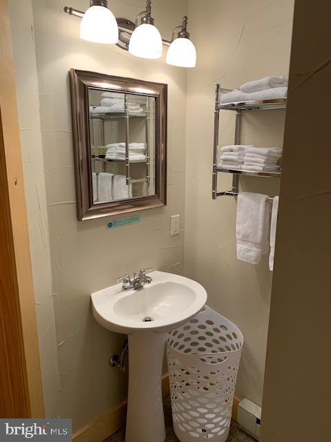 1461 Big Creek Road Clearville, PA 15535 - Photo 83 of 138 a bathroom with a sink a mirror and a toilet