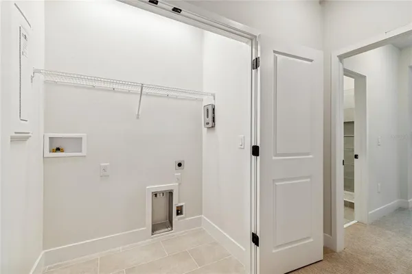 a view of a bathroom with a glass shower door