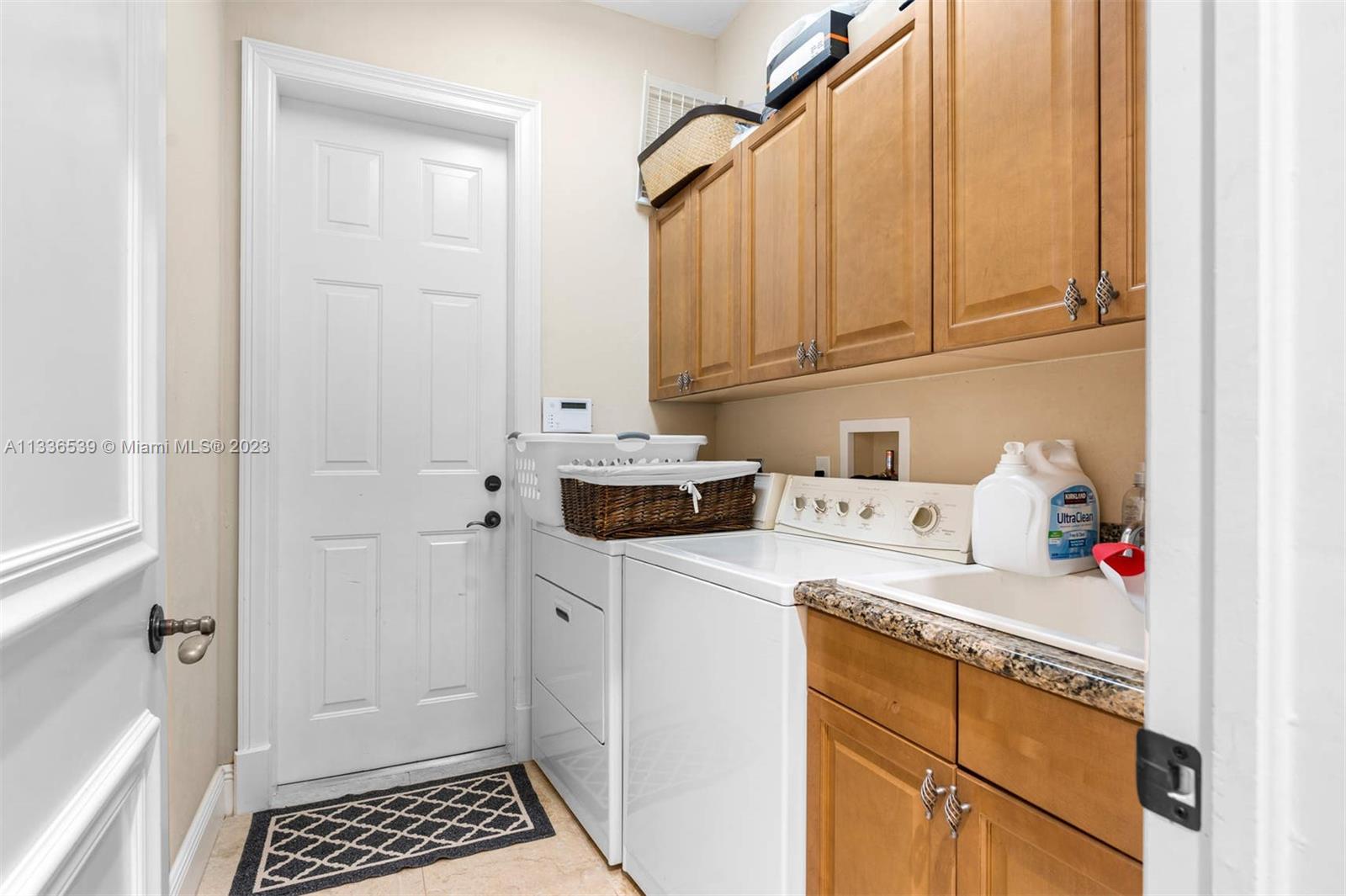 6911 Long Leaf Drive Parkland, FL 33076 - Photo 16 of 20 a utility room with sink dryer and washer