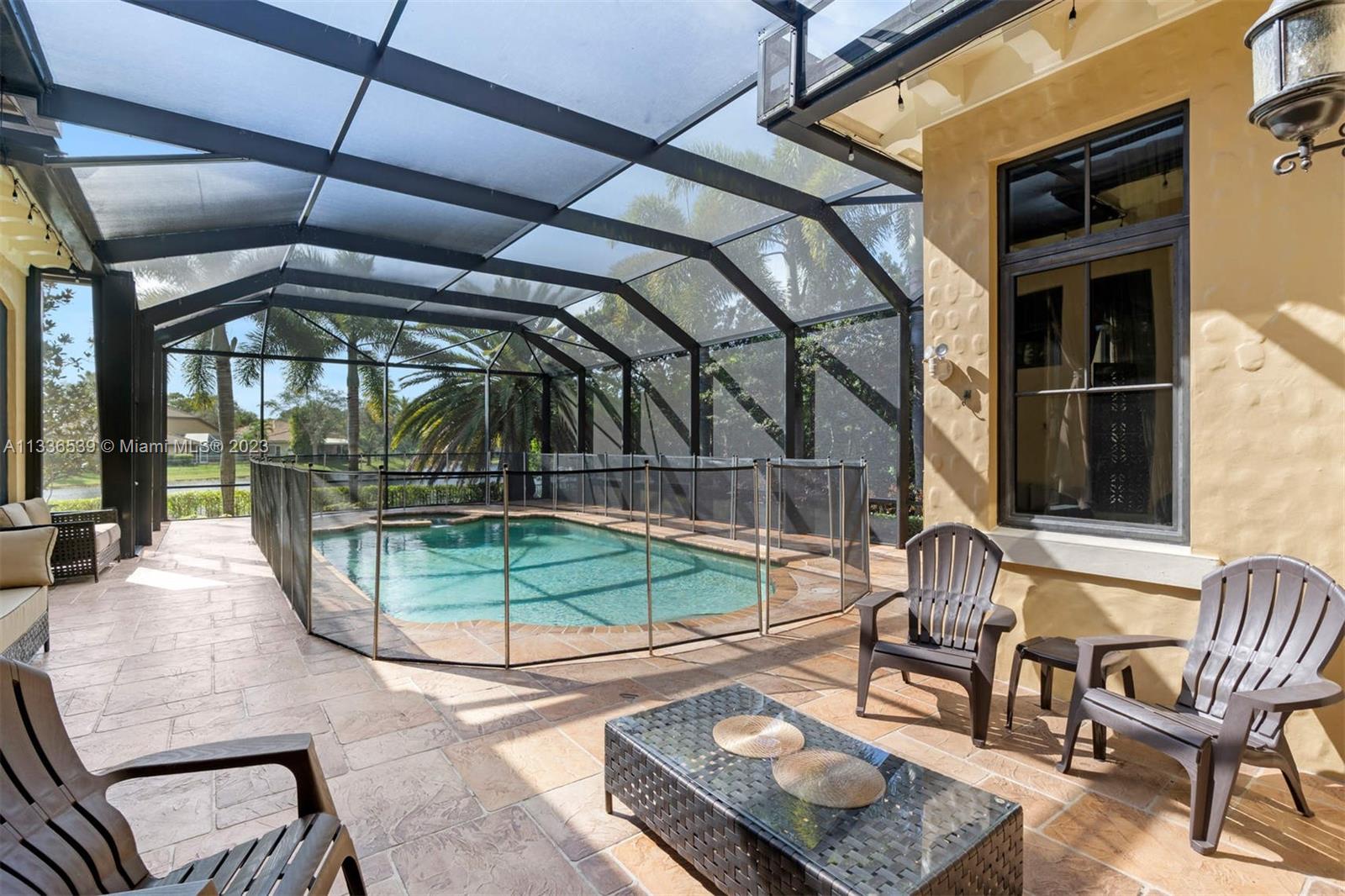 6911 Long Leaf Drive Parkland, FL 33076 - Photo 18 of 20 a backyard of a house with outdoor seating