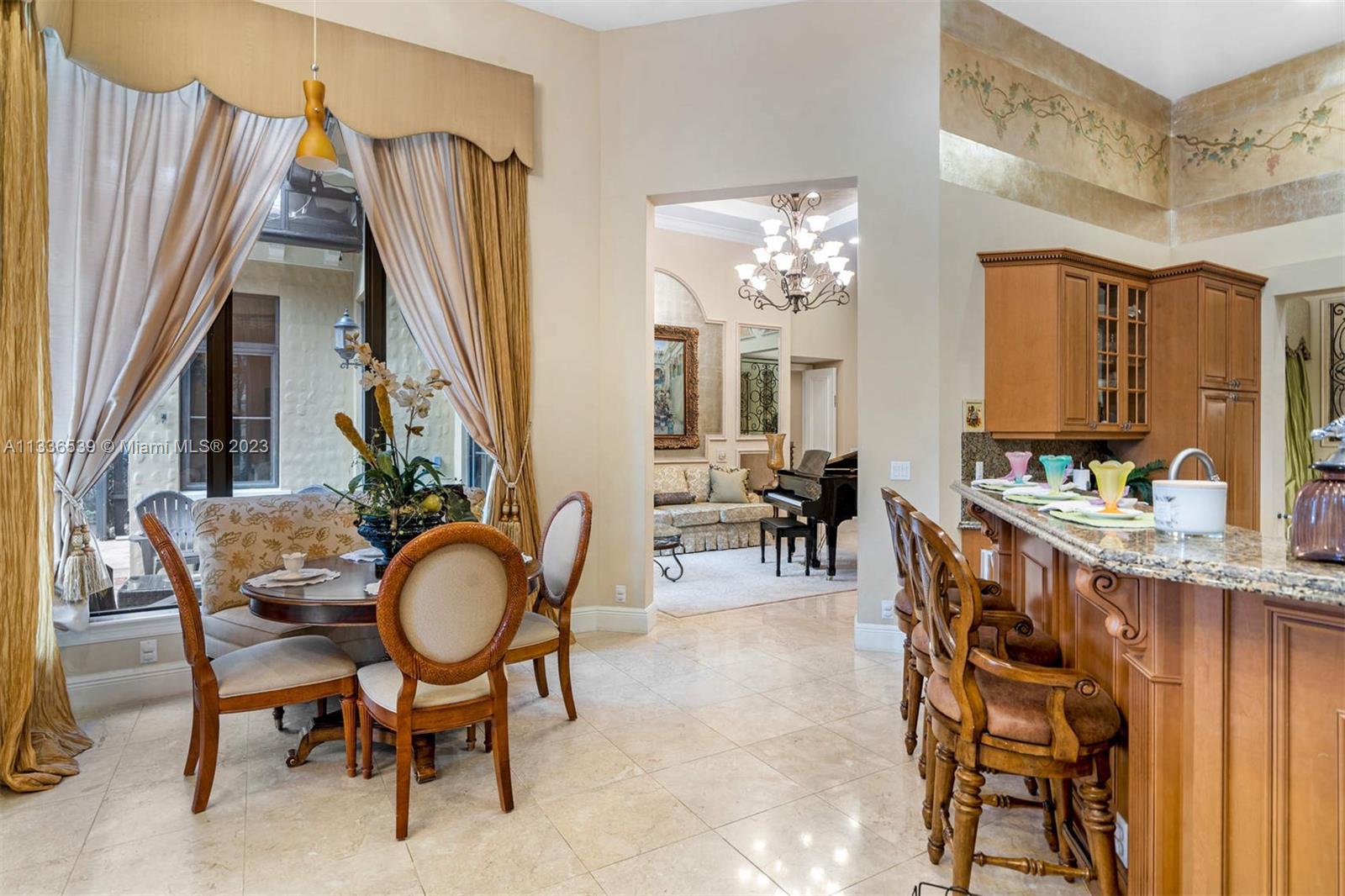 6911 Long Leaf Drive Parkland, FL 33076 - Photo 5 of 20 a view of a dining room with furniture and chandelier
