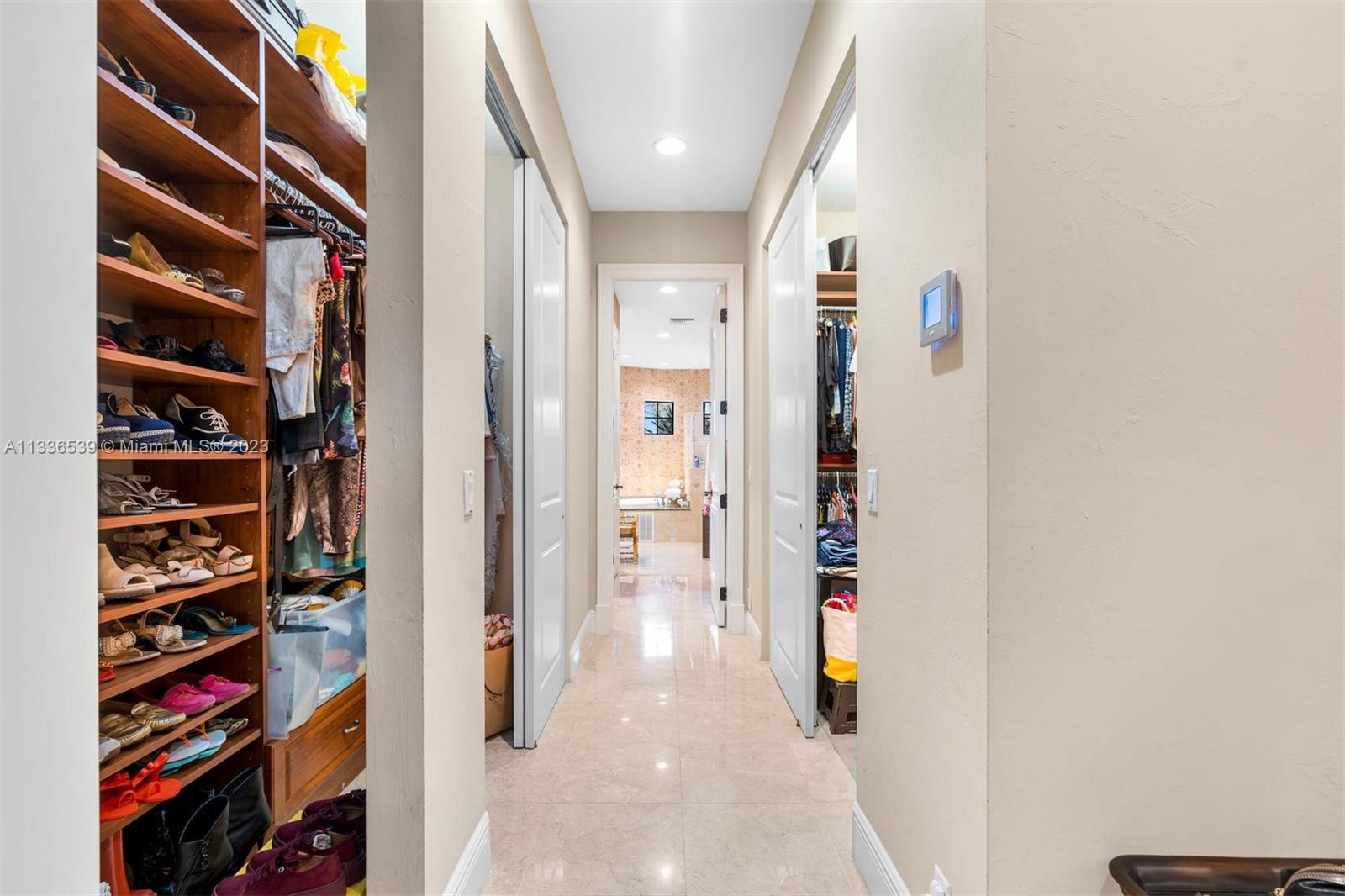 6911 Long Leaf Drive Parkland, FL 33076 - Photo 9 of 20 a view of walk in closet with clothes and shoes