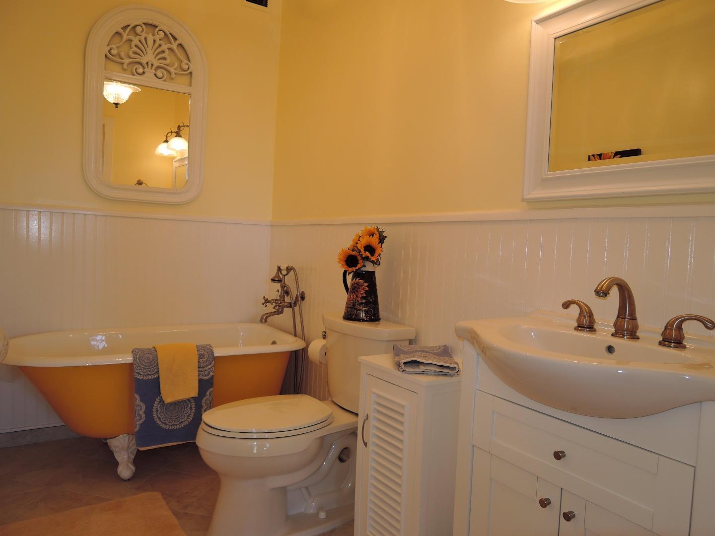 97 East St James Street, Unit 41 San Jose, CA 95112 - Photo 2 of 25 a bathroom with a toilet sink and mirror