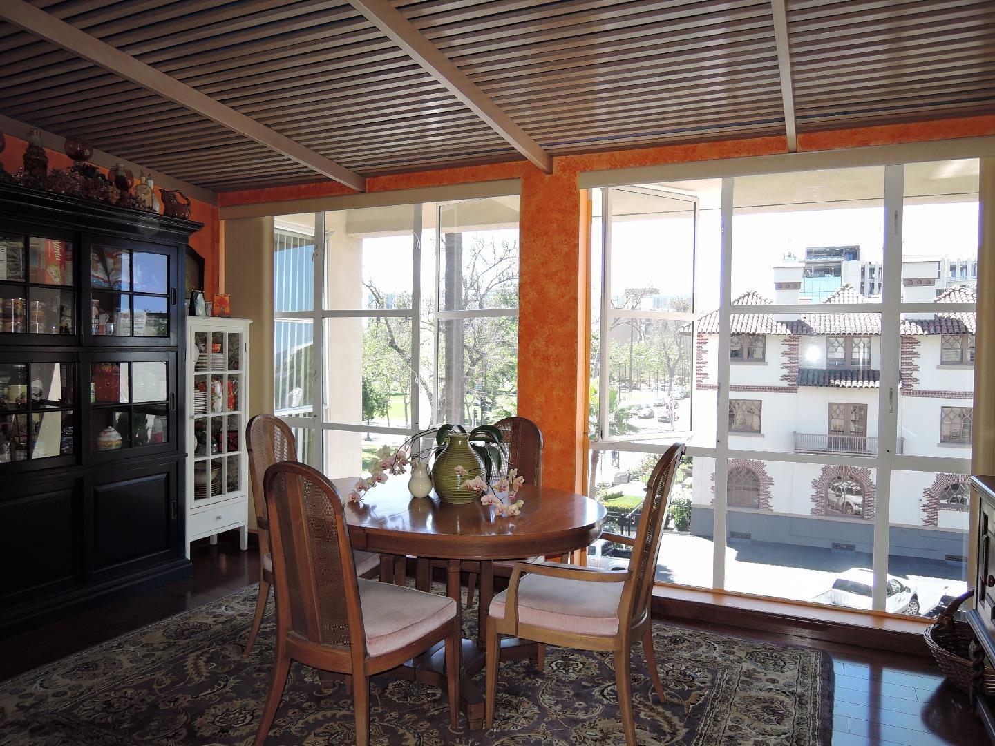97 East St James Street, Unit 41 San Jose, CA 95112 - Photo 3 of 25 a dining room with furniture and large windows