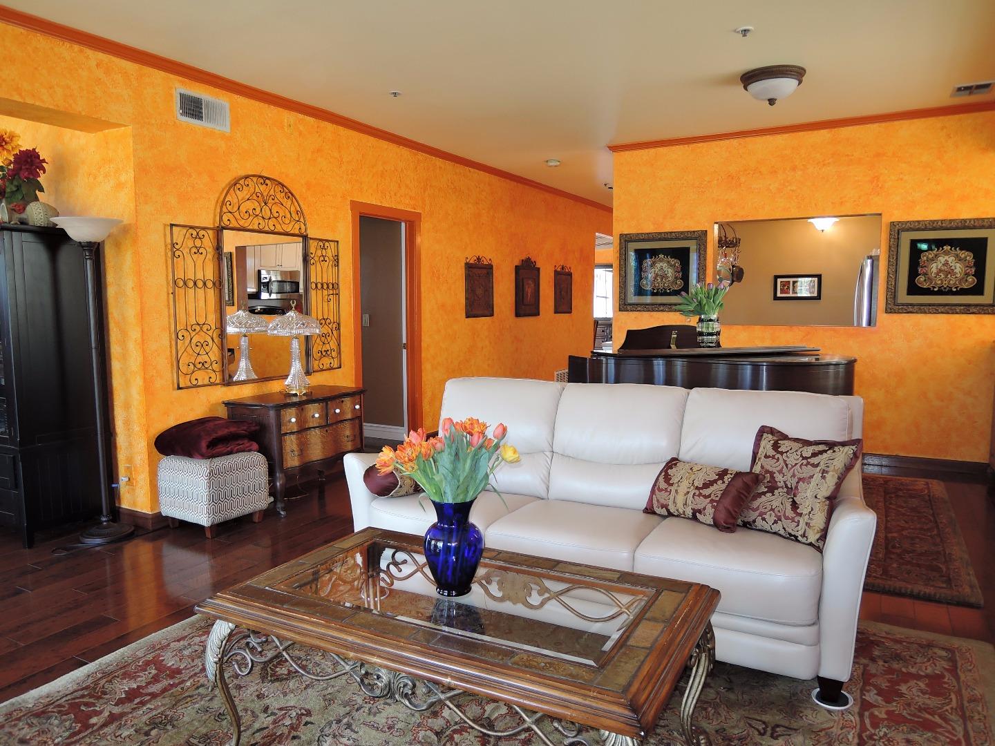 97 East St James Street, Unit 41 San Jose, CA 95112 - Photo 10 of 25 a living room with furniture and wooden floor