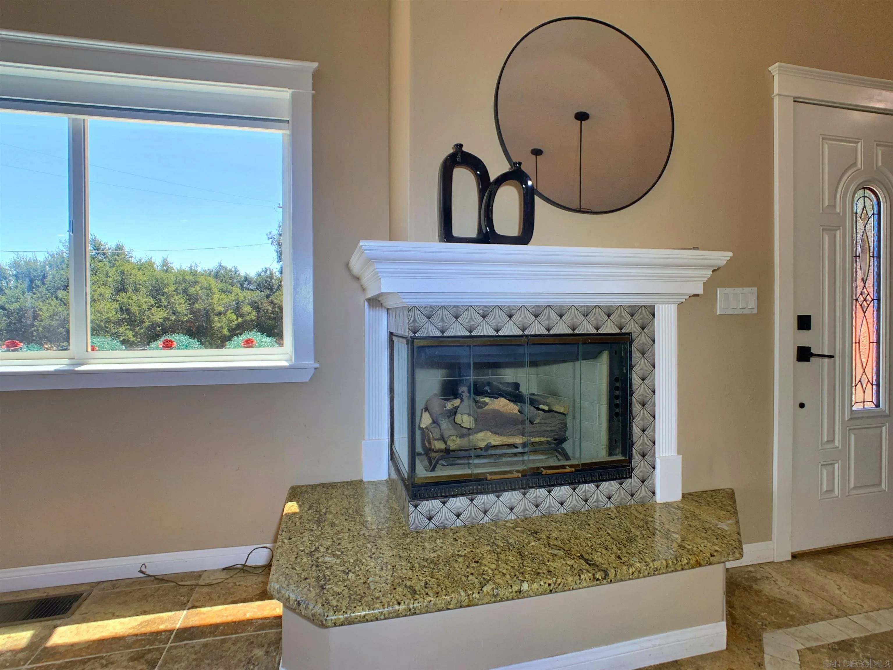 205 Highline Trail El Cajon, CA 92021 - Photo 32 of 45 a room with a fireplace and a fireplace