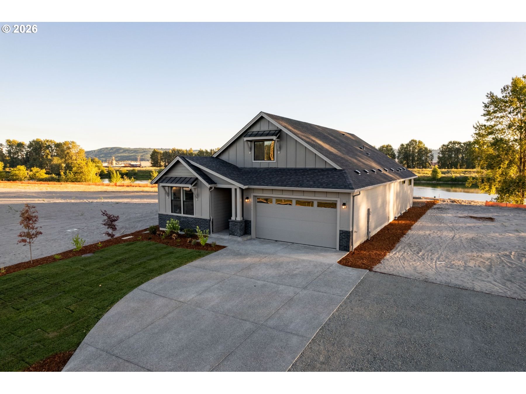 2072 South River Road Kelso, WA 98626 - Photo 18 of 22 a front view of a house with a yard