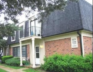 2125 North Ginger Creek Drive, Unit 2125 Palatine, IL 60074 - Photo 1 of 10 a brick building with a large windows