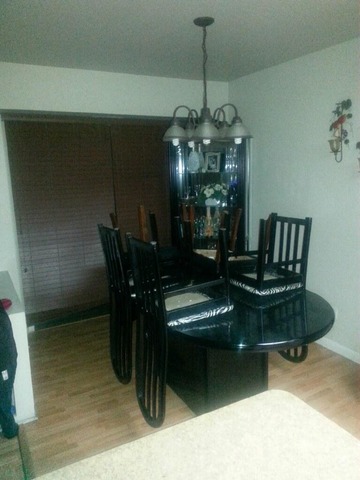 2125 North Ginger Creek Drive, Unit 2125 Palatine, IL 60074 - Photo 4 of 10 a living room with furniture and a chandelier