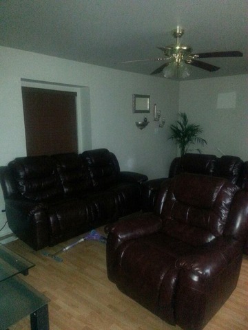 2125 North Ginger Creek Drive, Unit 2125 Palatine, IL 60074 - Photo 5 of 10 a living room with furniture
