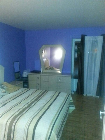 2125 North Ginger Creek Drive, Unit 2125 Palatine, IL 60074 - Photo 8 of 10 a bathroom with a sink and mirror