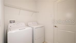 11142 Radiant Shr Loop San Antonio, FL 33576 - Photo 13 of 43 a utility room with dryer and washer