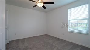 11142 Radiant Shr Loop San Antonio, FL 33576 - Photo 21 of 43 an empty room with a window