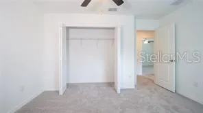 a white toilet sitting next to a bath tub