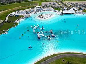 11142 Radiant Shr Loop San Antonio, FL 33576 - Photo 3 of 43 a view of a swimming pool with a garden