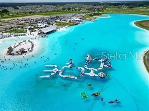 an aerial view of a residential houses with outdoor space
