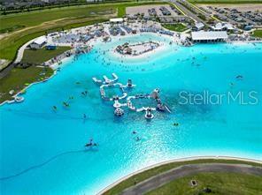 11142 Radiant Shr Loop San Antonio, FL 33576 - Photo 40 of 43 a view of a golf course with a lake