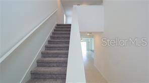 11142 Radiant Shr Loop San Antonio, FL 33576 - Photo 5 of 43 a view of staircase with white walls