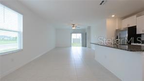 11142 Radiant Shr Loop San Antonio, FL 33576 - Photo 10 of 43 a view of a livingroom and a fireplace