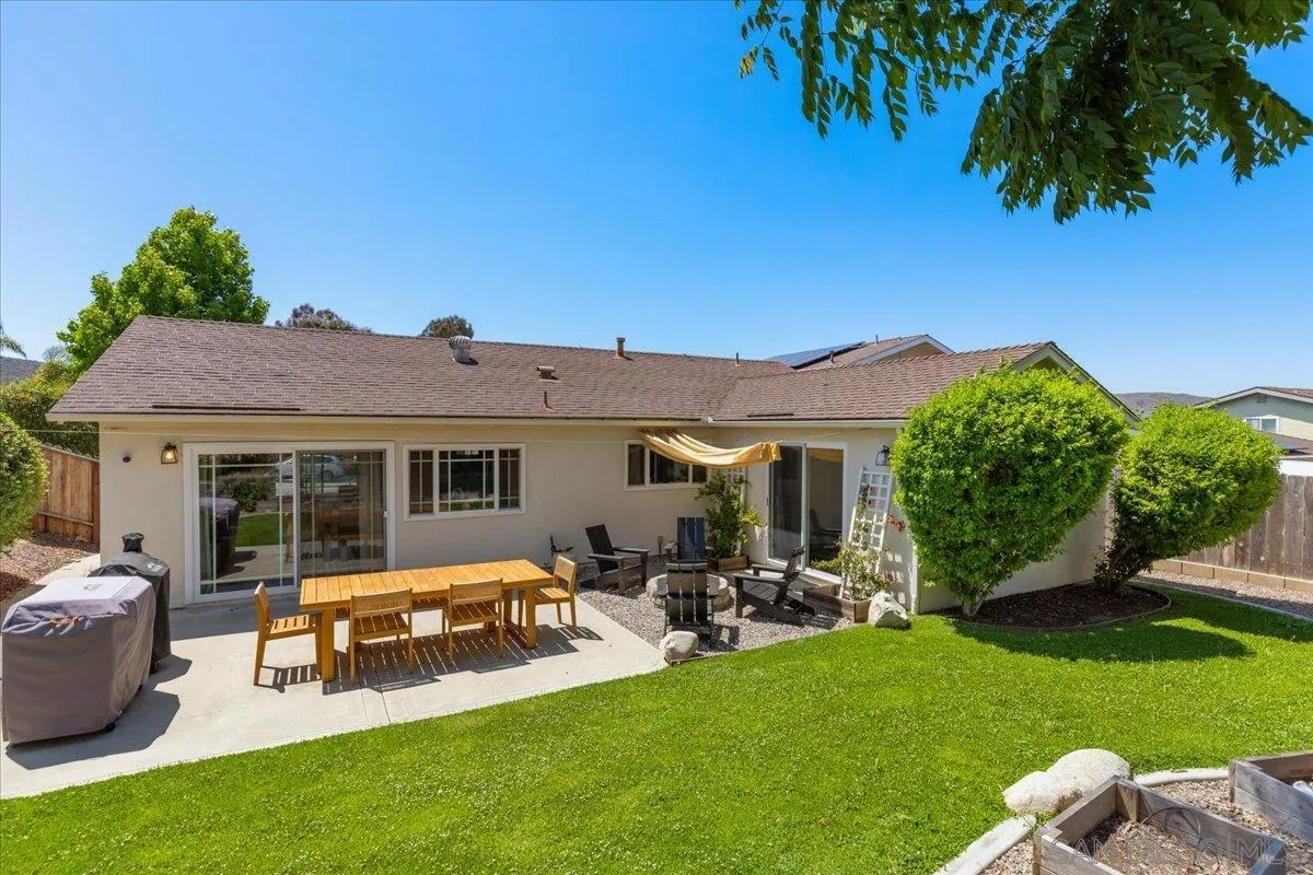 12243 Buckskin Trail Poway, CA 92064 - Photo 18 of 41 a view of a house with backyard sitting area and garden