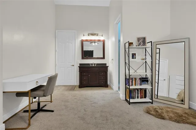 a view of kitchen with furniture and electronic appliances