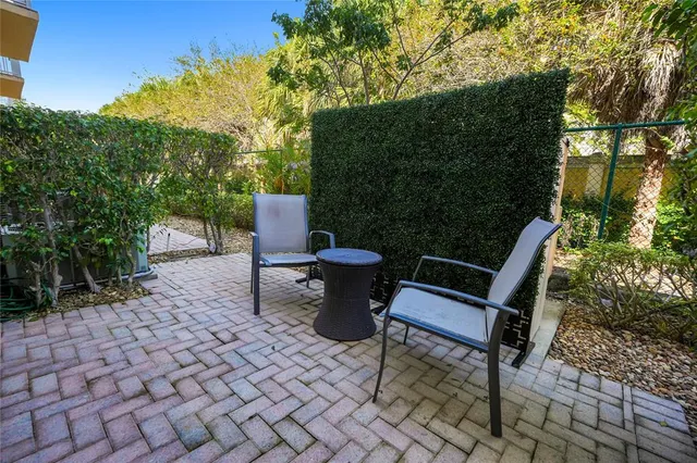a view of a chairs and tables in the backyard