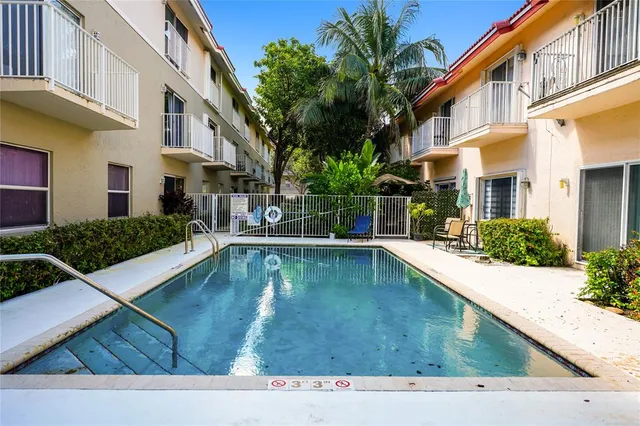 a view of a house with swimming pool