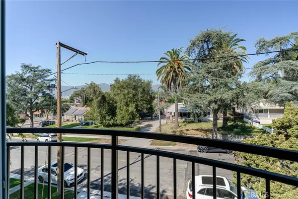 a view of a street from a balcony